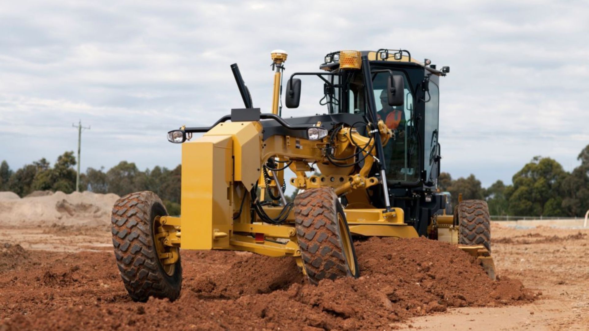 a grader on a construction site showing grader safety